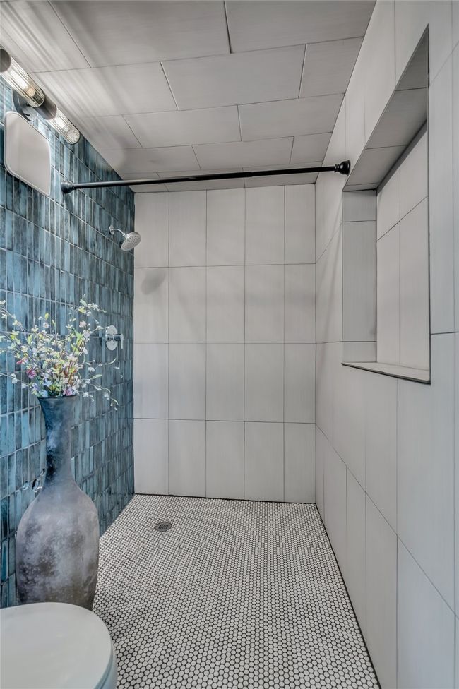 Washroom with separate washer and dryer and cabinet space | Image 28