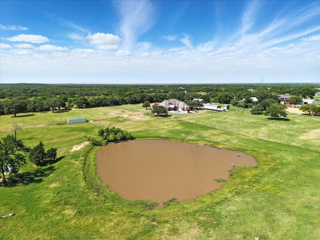 Aerial view of a nearby body of water and a forest | Image 31