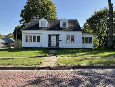 Cape cod house with a front lawn | Image 1