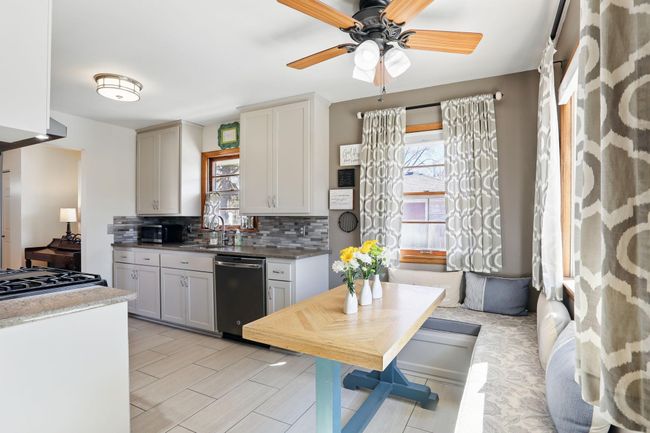 Cozy banquette dining area ideal for morning coffee and breakfast | Image 9