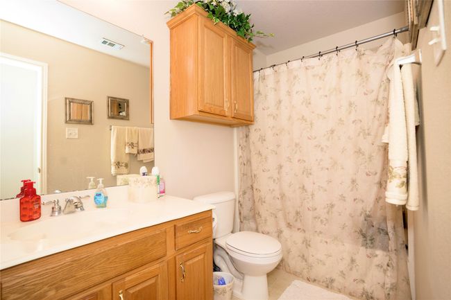Full bathroom featuring vanity, tile patterned flooring, and a shower with shower curtain | Image 19