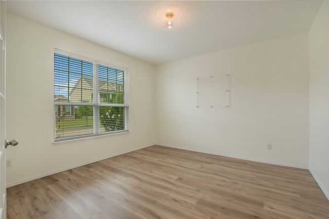 Empty room with light wood finished floors and baseboards | Image 5