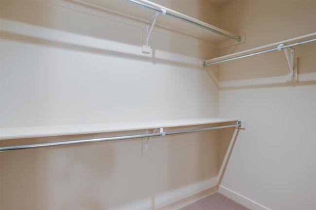 Walk in closet with carpet floors | Image 30