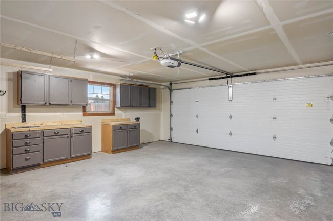 Large garage with cabinets | Image 42