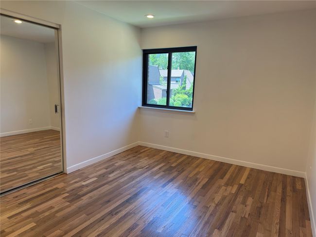Unfurnished room featuring wood finished floors, baseboards, and recessed lighting | Image 20