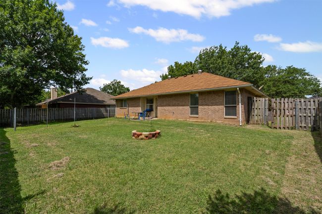 View of fenced backyard | Image 24