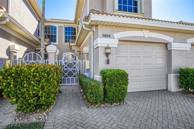View of exterior entry featuring a garage | Image 7