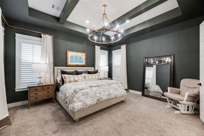 Bedroom with a chandelier, carpet, beam ceiling, recessed lighting, and baseboards | Image 22