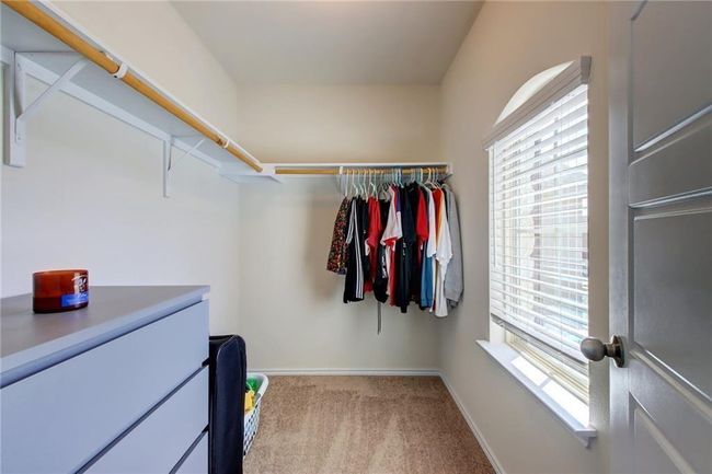 Walk in closet with carpet floors | Image 28