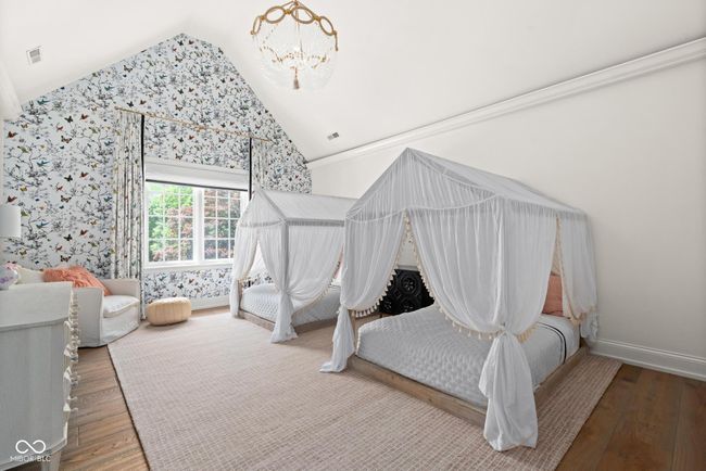Second bedroom featuring lofted ceiling | Image 55