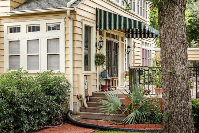 Entrance to property with a shingled roof | Image 6