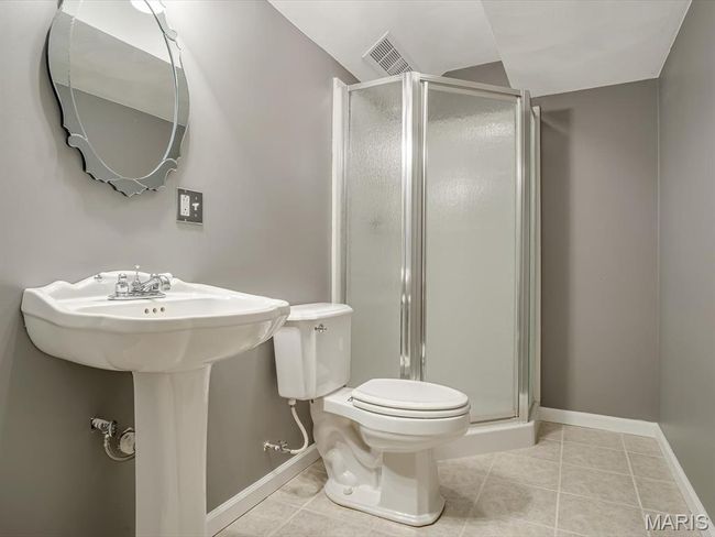 Full bath featuring a shower stall and tile flooring | Image 28