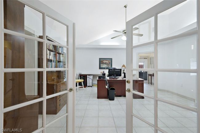 Office space featuring light tile patterned flooring, french doors, and ceiling fan | Image 16