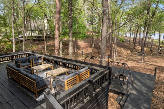 Wooden deck with outdoor lounge area and a water view | Image 6