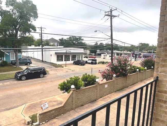 View of asphalt street featuring street lighting | Image 10