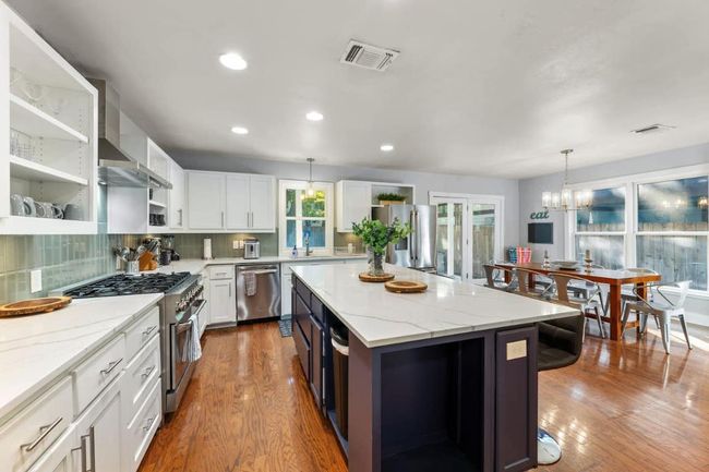 Kitchen open to dining | Image 12