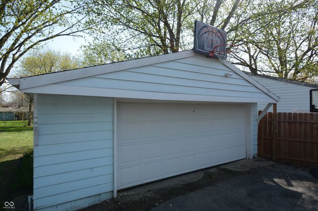 detached garage with fence | Image 44