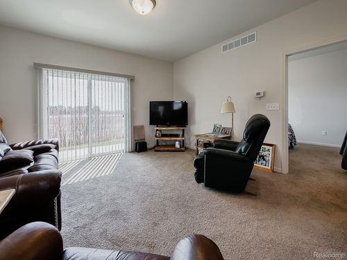825 Plum Village Dr, Raisinville Twp, MI, 48161-9670 | Card Image
