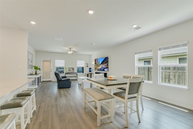Dining area featuring a ceiling fan, light wood-style flooring, baseboards, and recessed lighting | Image 6