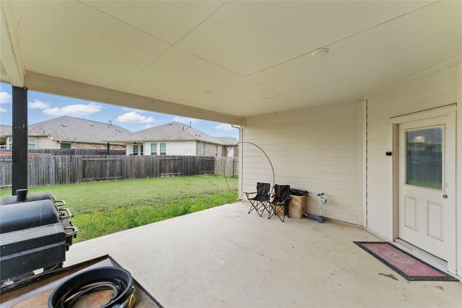 View of patio featuring a fenced backyard | Image 33