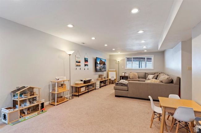 Carpeted living room with recessed lighting | Image 21