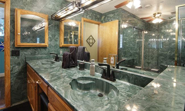 Primary bath with double sinks; mirrored doors on closet | Image 16