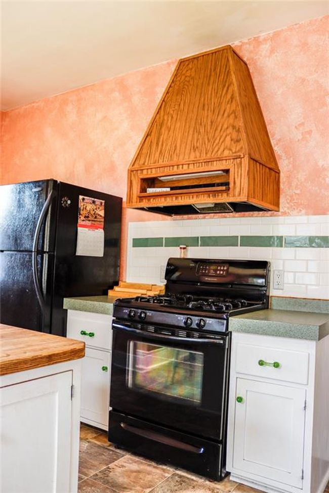 A Beautiful Kitchen area with a gas stove | Image 16