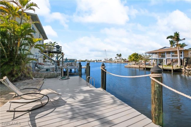 Dock area featuring a water view | Image 45
