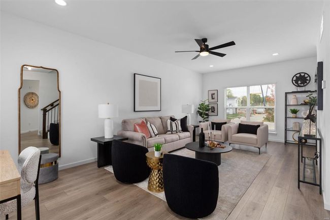 Living room featuring ceiling fan and light hardwood / wood-style floors | Image 5