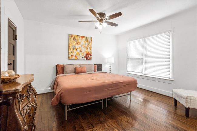 Bedroom with wood finished floors and a ceiling fan | Image 18