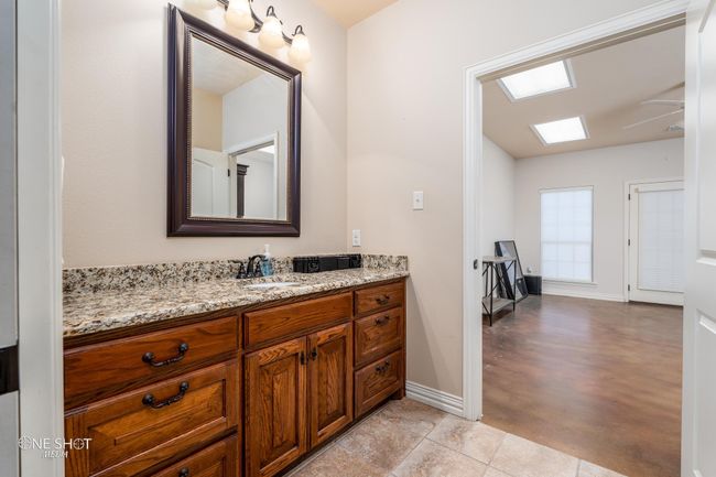 Bathroom with baseboards and vanity | Image 30