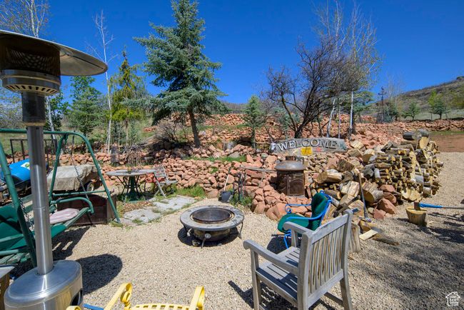 View of yard with a fire pit | Image 50