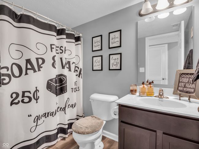 full bath with visible vents, baseboards, toilet, wood finished floors, and vanity | Image 16