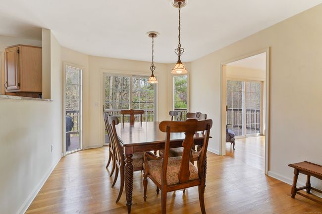 Dining room with sliders to the deck | Image 7