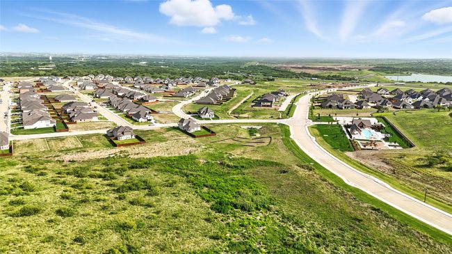 Aerial perspective of suburban area featuring a nearby body of water | Image 34