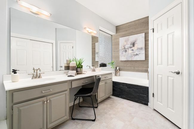 Bathroom featuring double vanity and a garden tub | Image 16