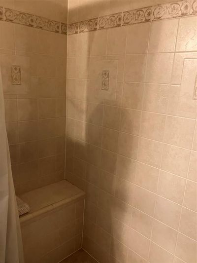 Bathroom with a shower with curtain | Image 3