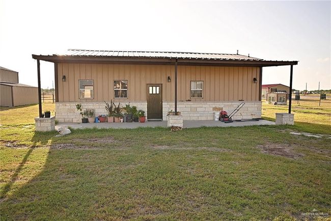 Rear view of house with a yard | Image 16