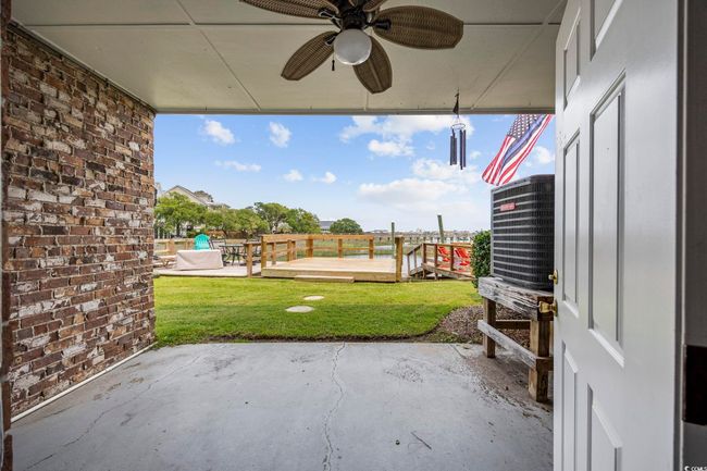 View of patio / terrace with a deck and a ceiling fan | Image 38
