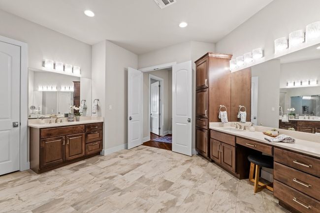 Full bathroom with two vanities, visible vents, and a sink | Image 18