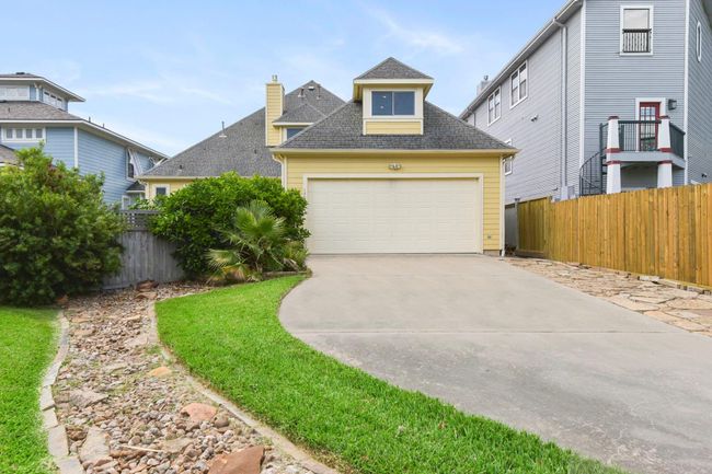 Convenient rear entrance with additional parking space. | Image 42