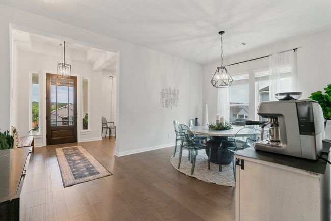 Foyer entrance with plenty of natural light, a chandelier, and dark wood-type flooring | Image 7