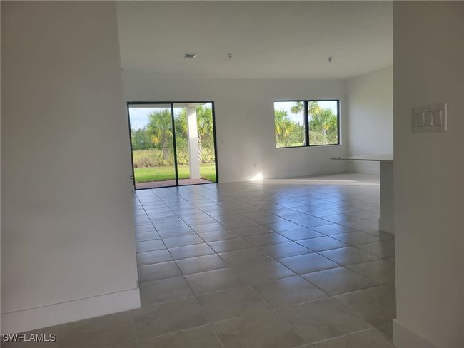 Tiled spare room with baseboards | Image 30