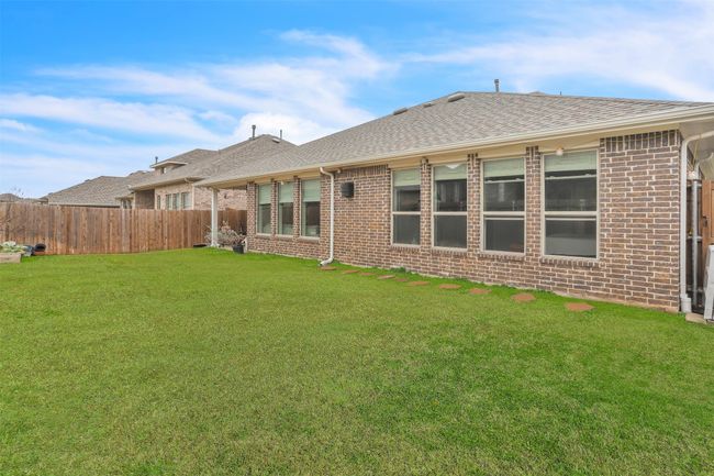 Back of property featuring a lawn | Image 31