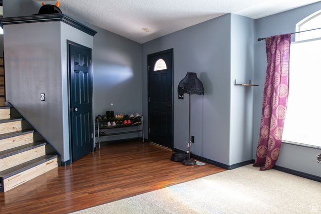 Entrance foyer with stairway, wood finished floors, baseboards | Image 4