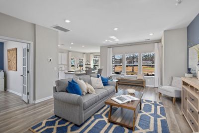 Living room featuring light hardwood / wood-style floors and sink | Image 3