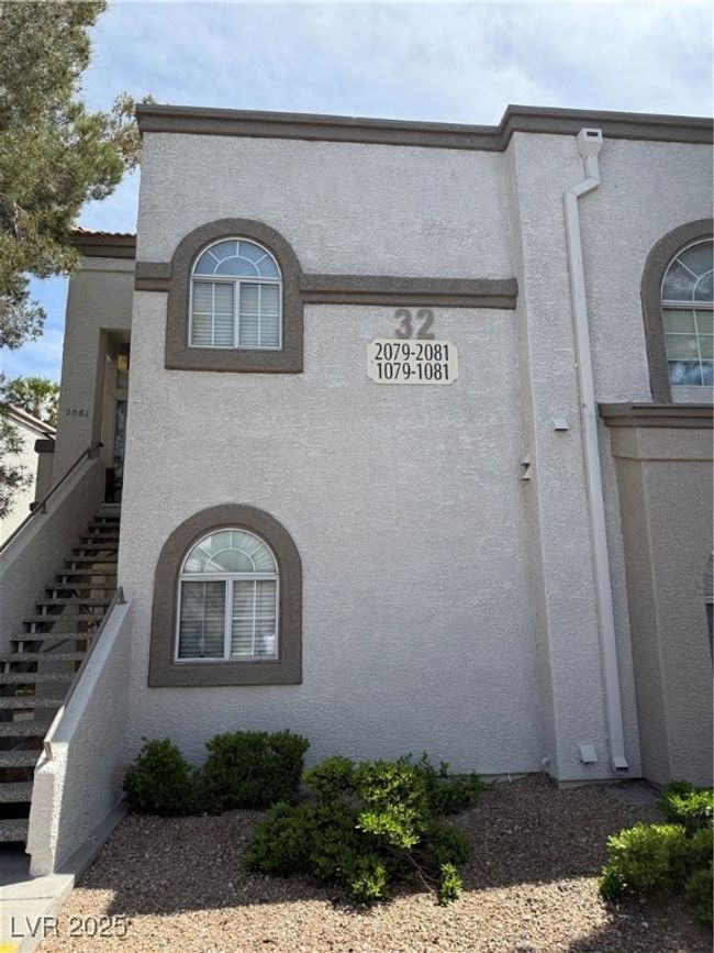 View of side of home with stucco siding and stairway | Image 13