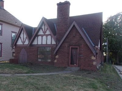 English style home with a front yard | Image 1