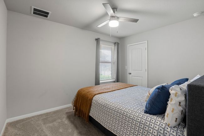 Carpeted bedroom featuring baseboards and ceiling fan | Image 20