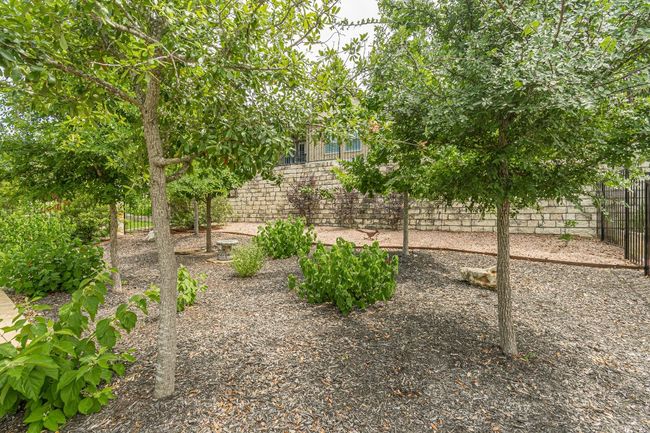 View of fenced backyard | Image 36
